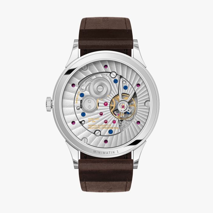 NOMOS  Minimatik 39 Datum gold - Blick durch den Glasboden auf das Uhrwerk